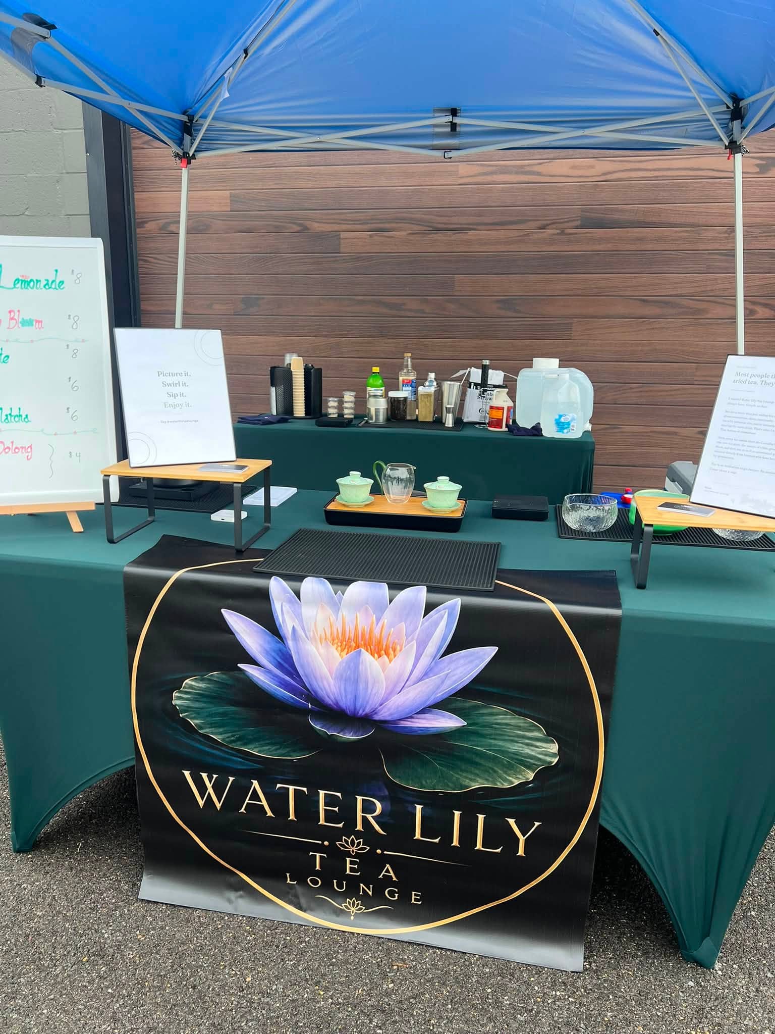 The Water Lily booth with its lotus banner at a pop-up